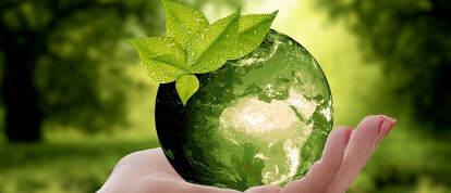 holding a green globe