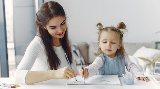 mother and daughter painting activity