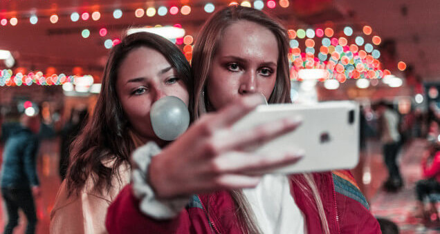girls taking selfies
