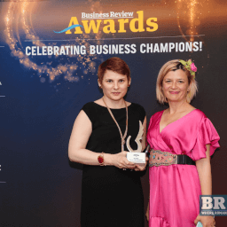 Alexandra Badea and Andreea Radu posing with the award at Business Review event